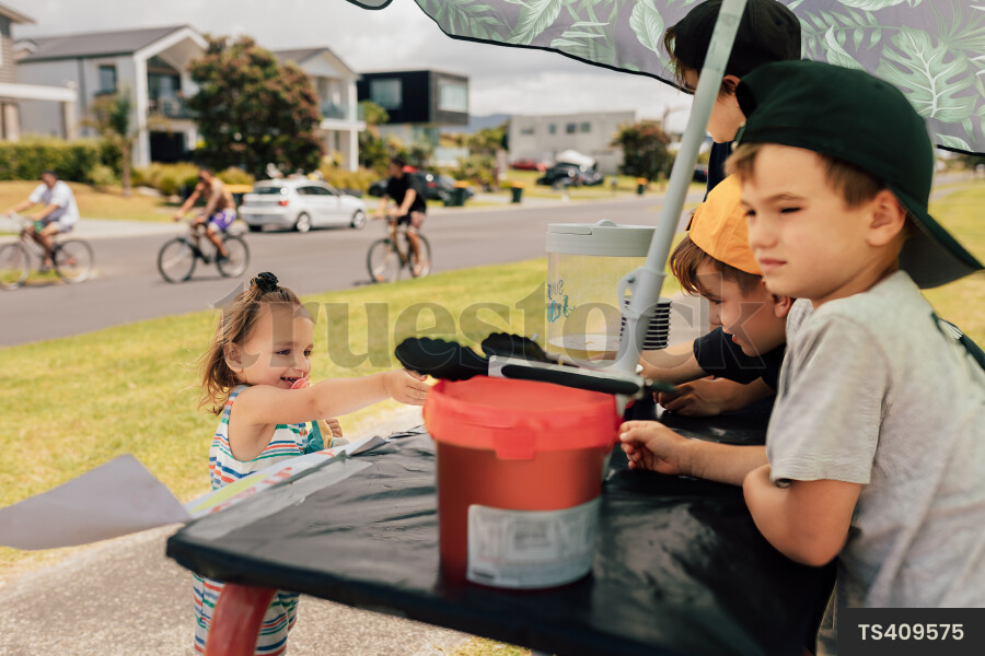Kids Buying Lemonade at Lemonade Stand