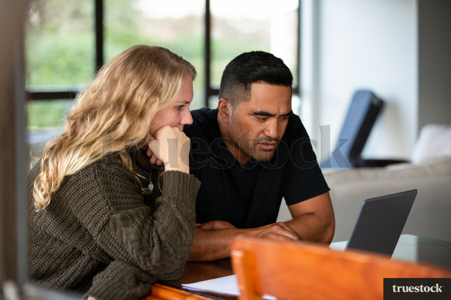 Parents Using Laptop
