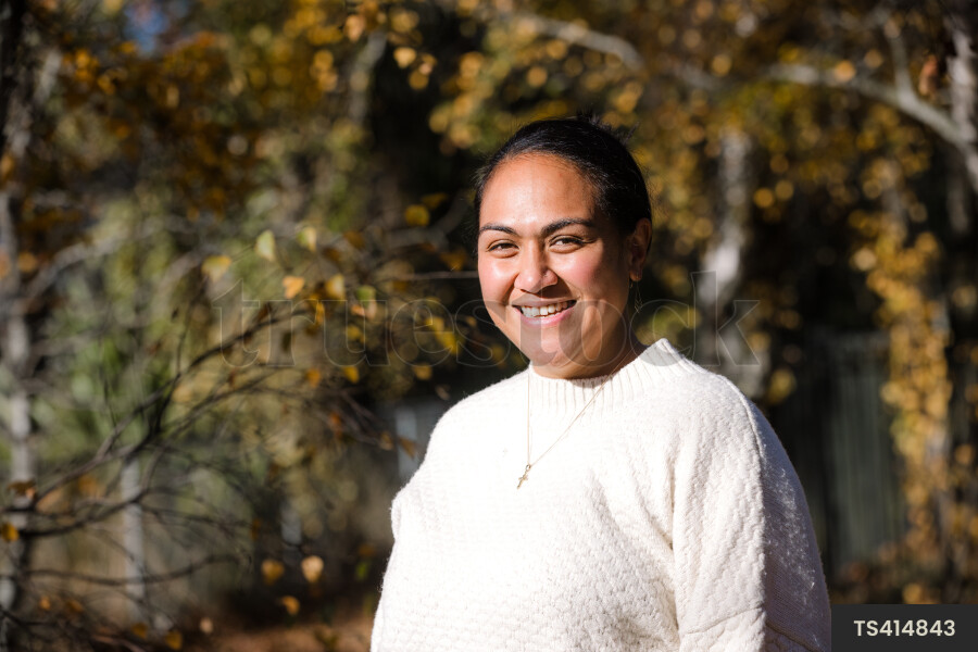 Portrait of woman in park during autumn