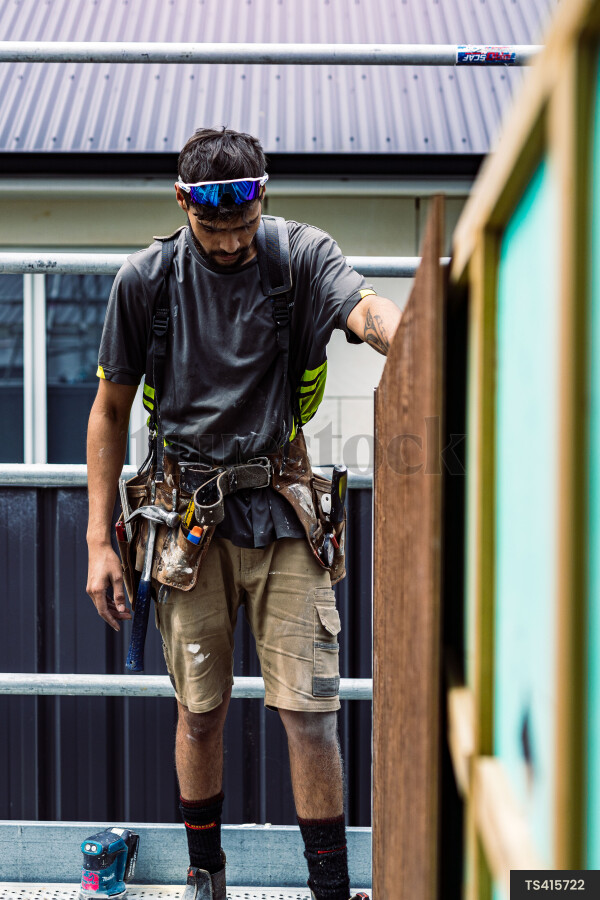 Builders Putting Up Fence
