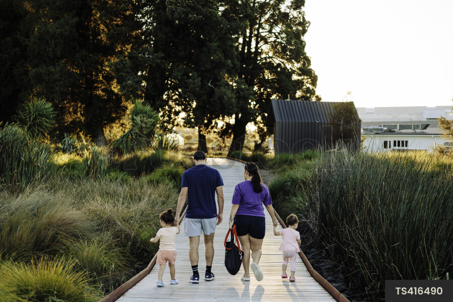 Family Walking Through Park