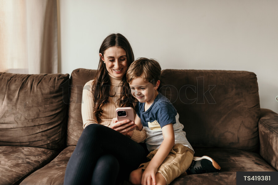 Mother and Son Using Phone
