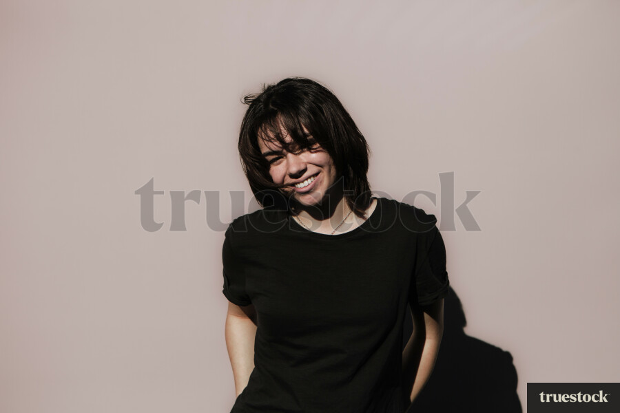 Māori Woman against a Plain Background
