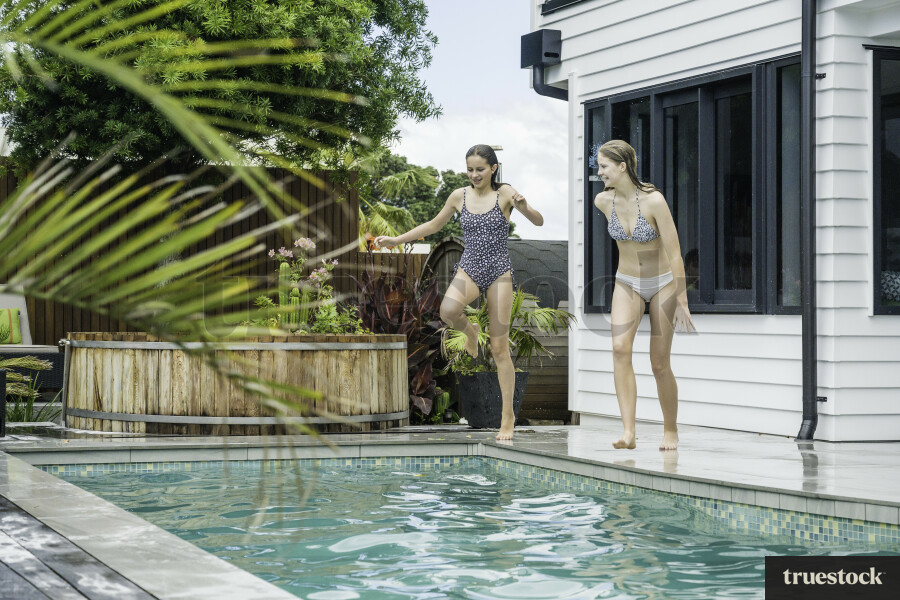 Girls Jumping into Pool