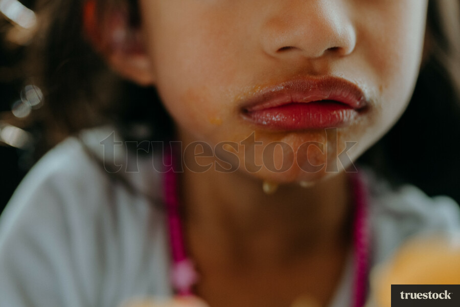 Juice from fruit on child's lips