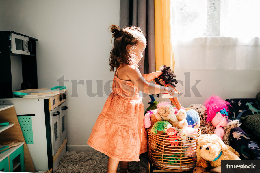 Māori girl playing in her room