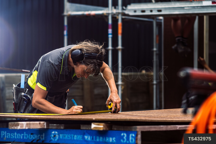 Woman Using Measuring Tape