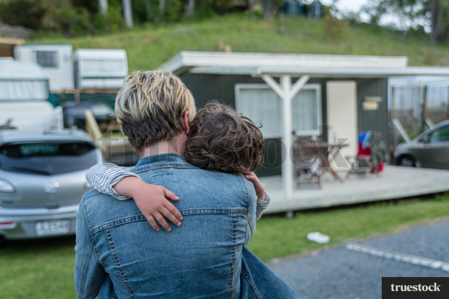 Mum giving child a hug