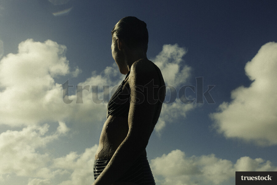 Woman Swimming at Piha Beach