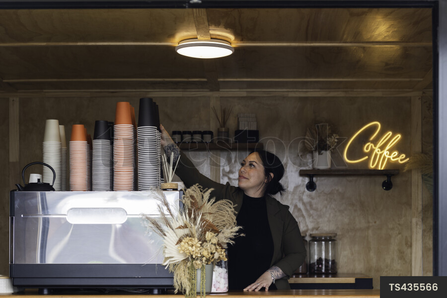 Barista Grabbing Cup
