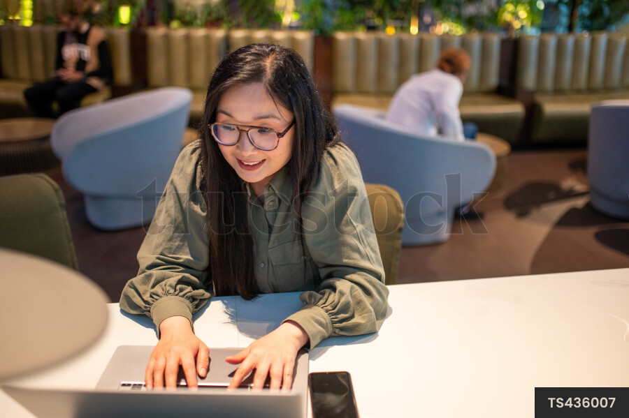 Woman Using Laptop for Work