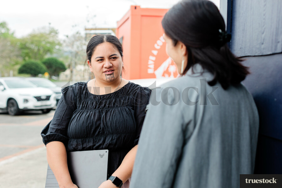 Colleagues Talking While Walking