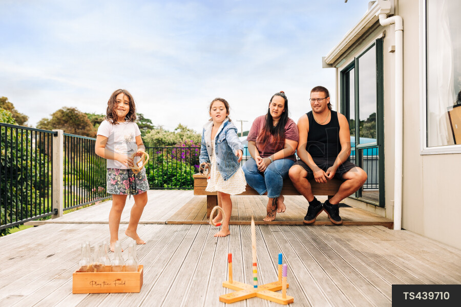Family playing on deck