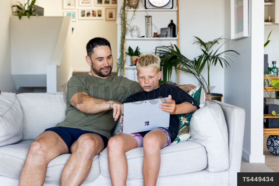 Father and Son Using Laptop