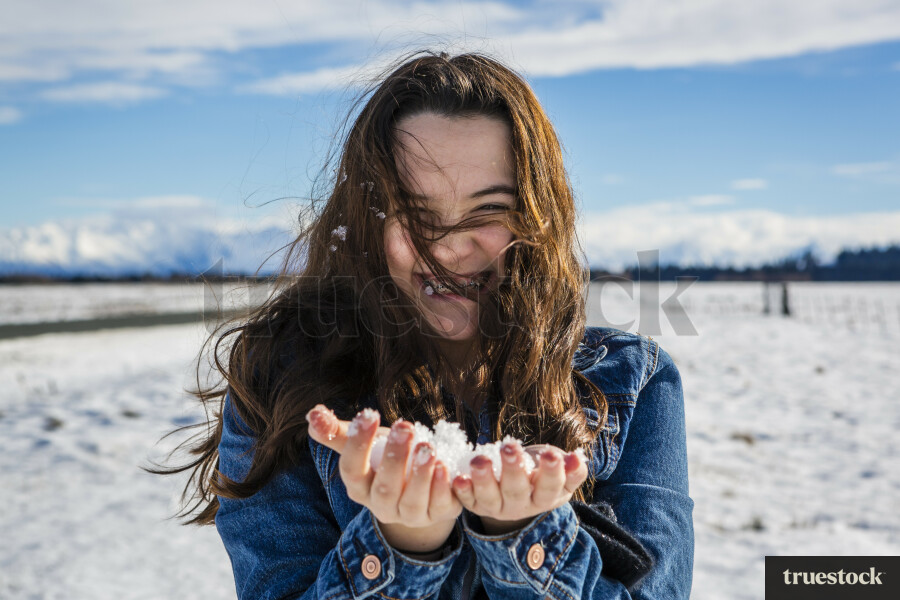 Teen Girl Holding Snow