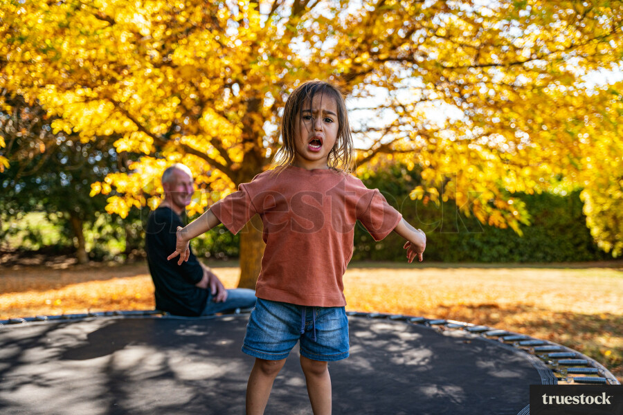 Child Playing on Trampoline