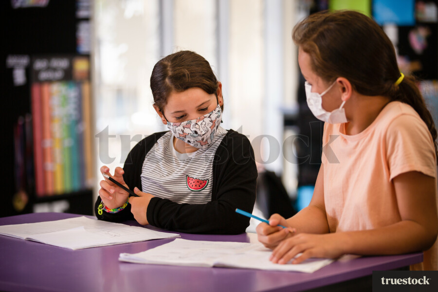 Year 5 Girls Working In Classroom