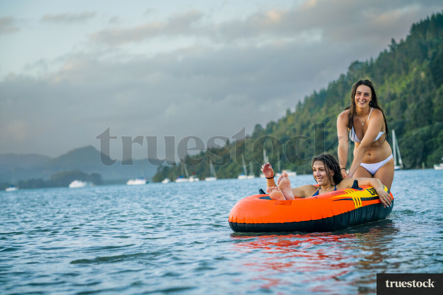 Woman Relaxing in an Inflatable Boat