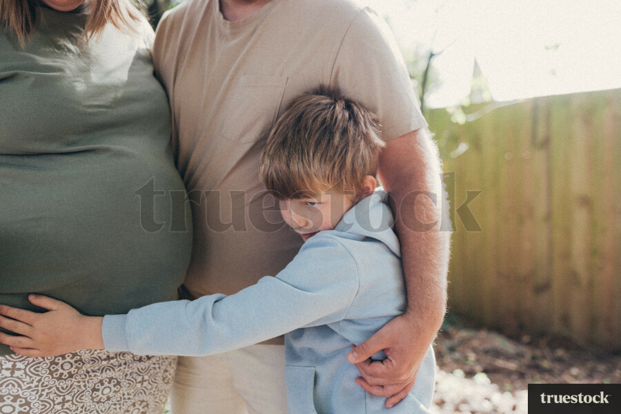 Son Hugging Pregnant Mum