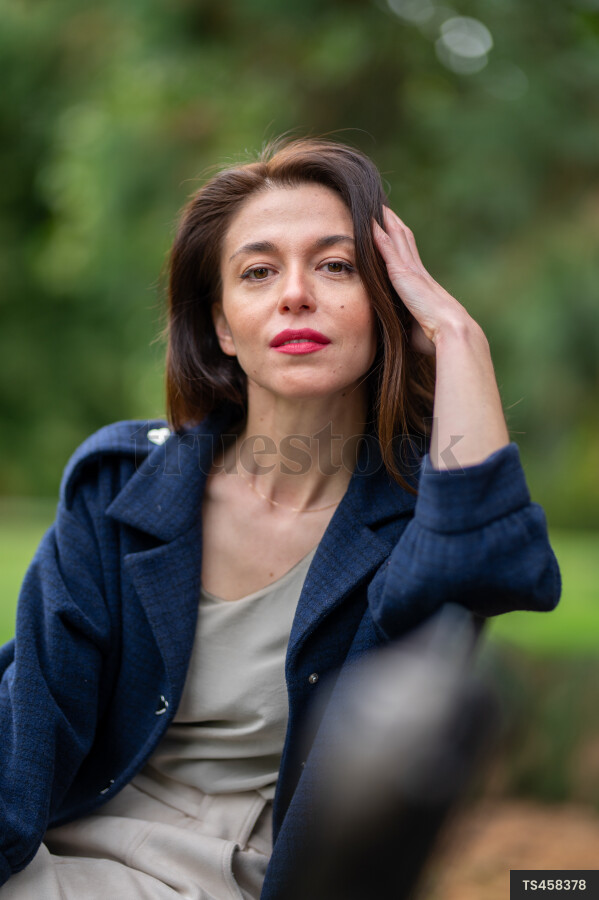 Woman sitting on park bench