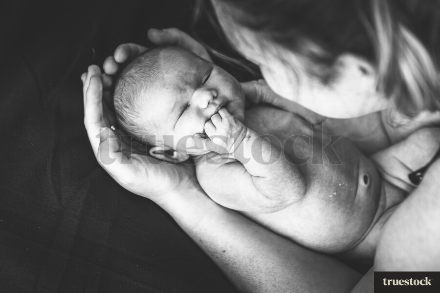 Mother holding baby in arms