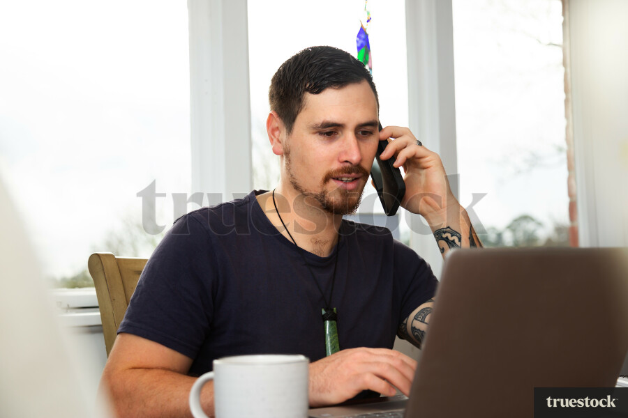 Dad on Phone Call while Working from Home