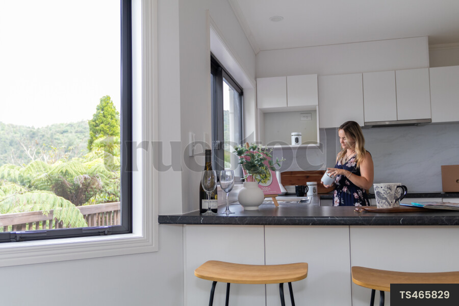 Woman packing in kitchen