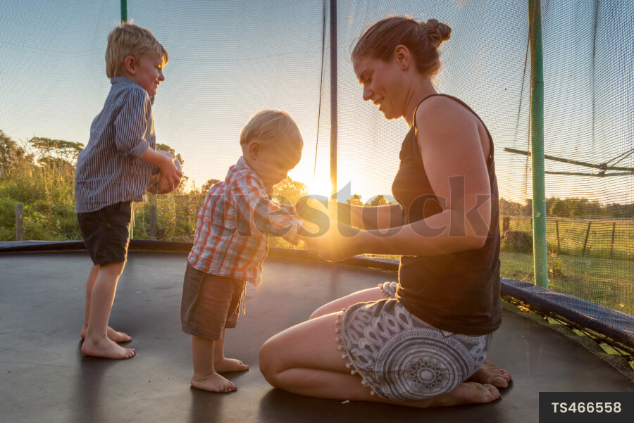 Mother and Kids on Trampoline