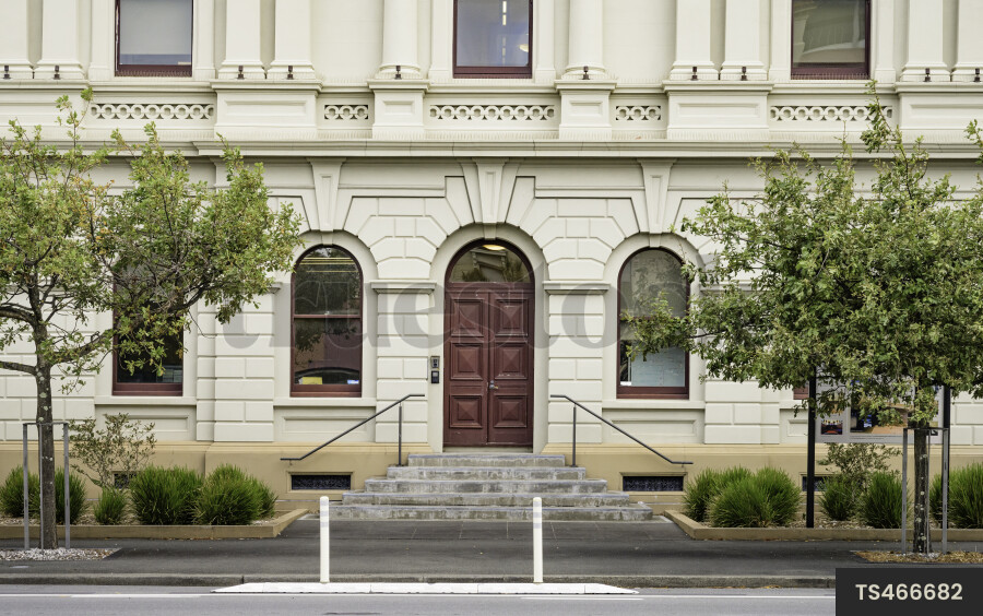 Building with arch features in street