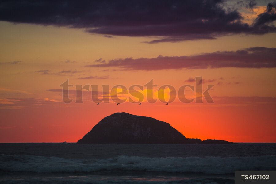 Island and sea at sunset