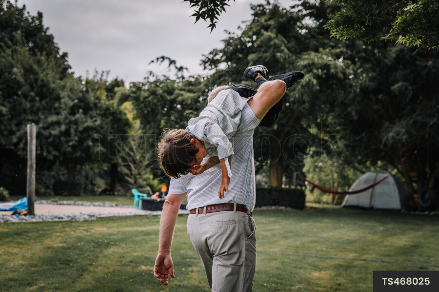 Father and Son Playing in Garden