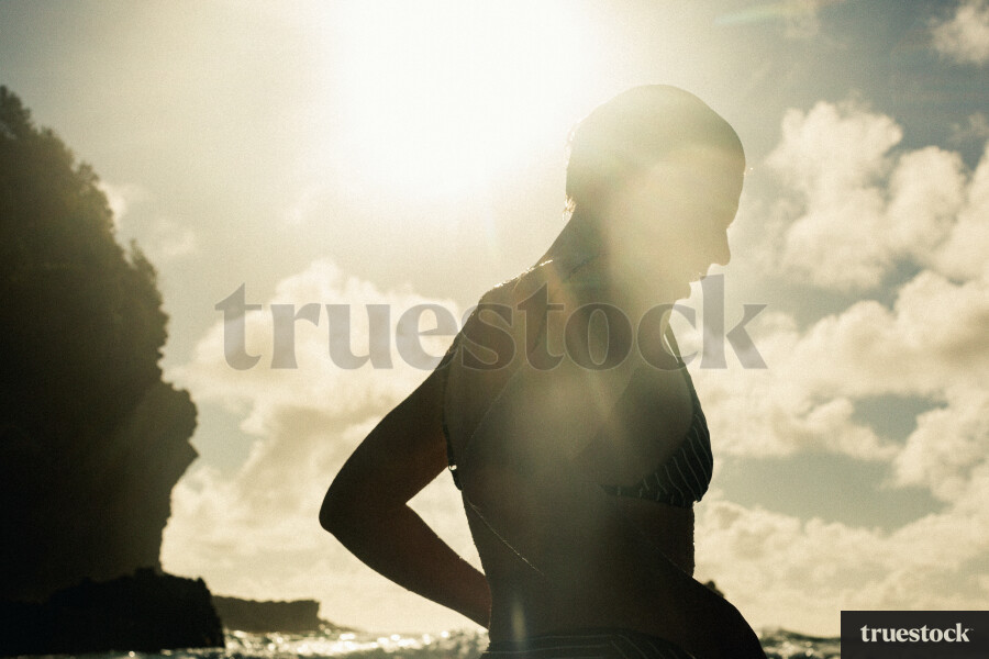 Woman Swimming at Piha Beach