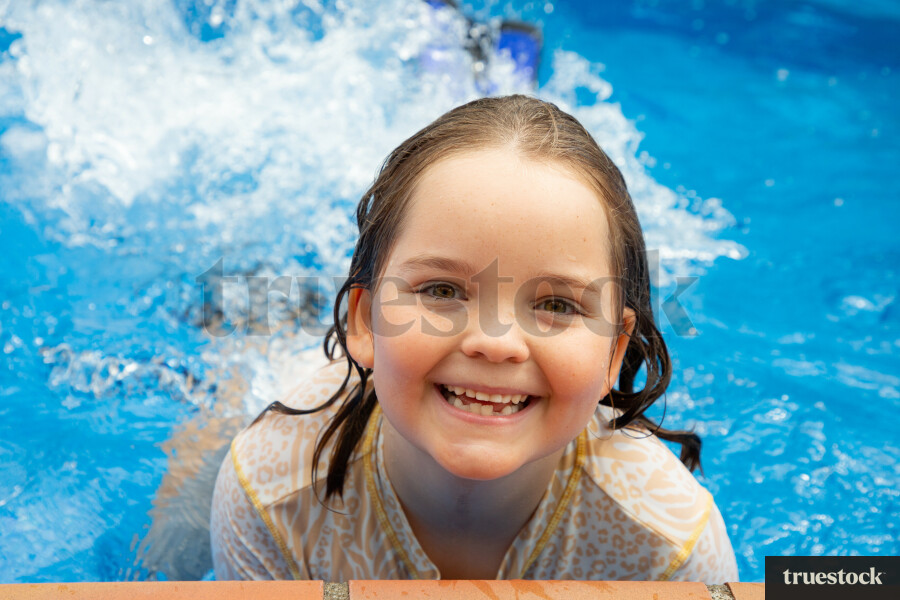 Girl Swimming at the Pools