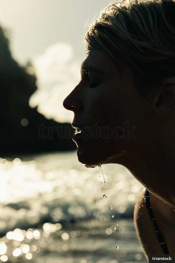 Woman Swimming at Piha Beach