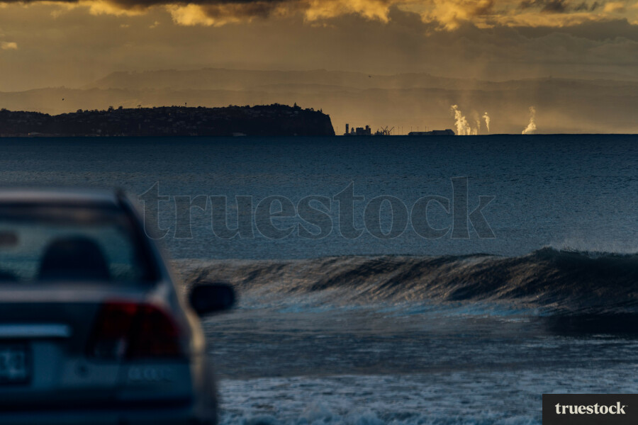 Car at the beach at sunset