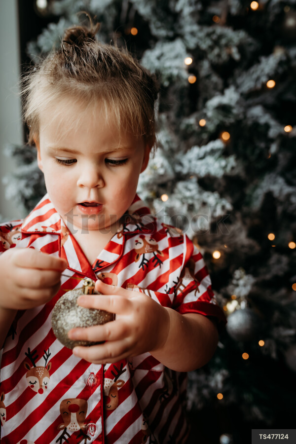 Young Girl with Christmas Tree