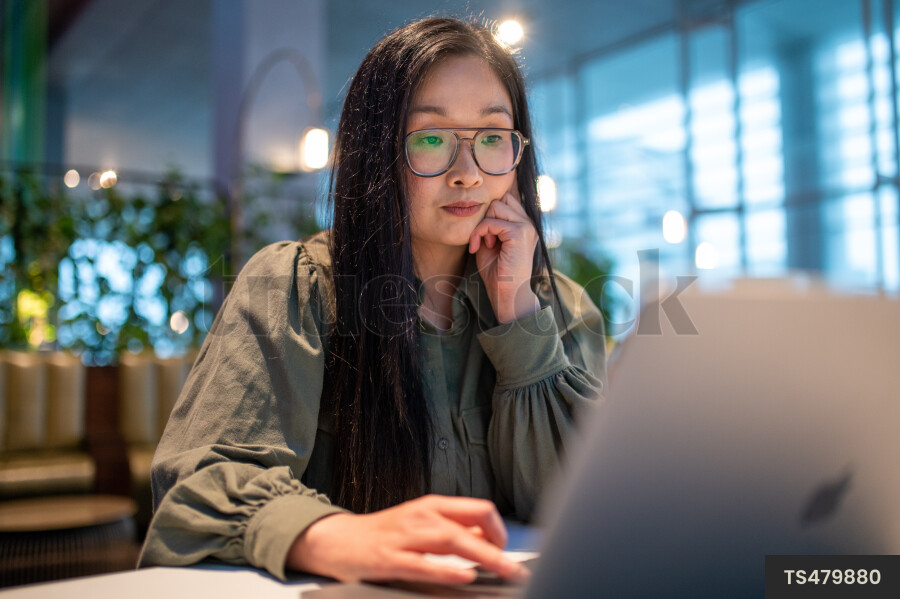 Woman Using Laptop for Work