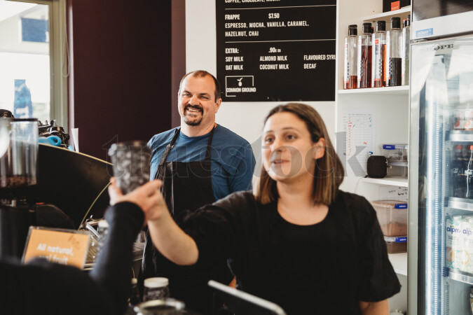 Worker Serving Customer Coffee