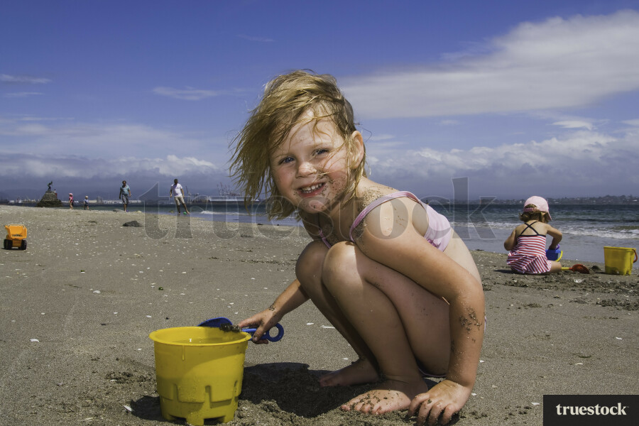 Little Girl Playing on the Beach
