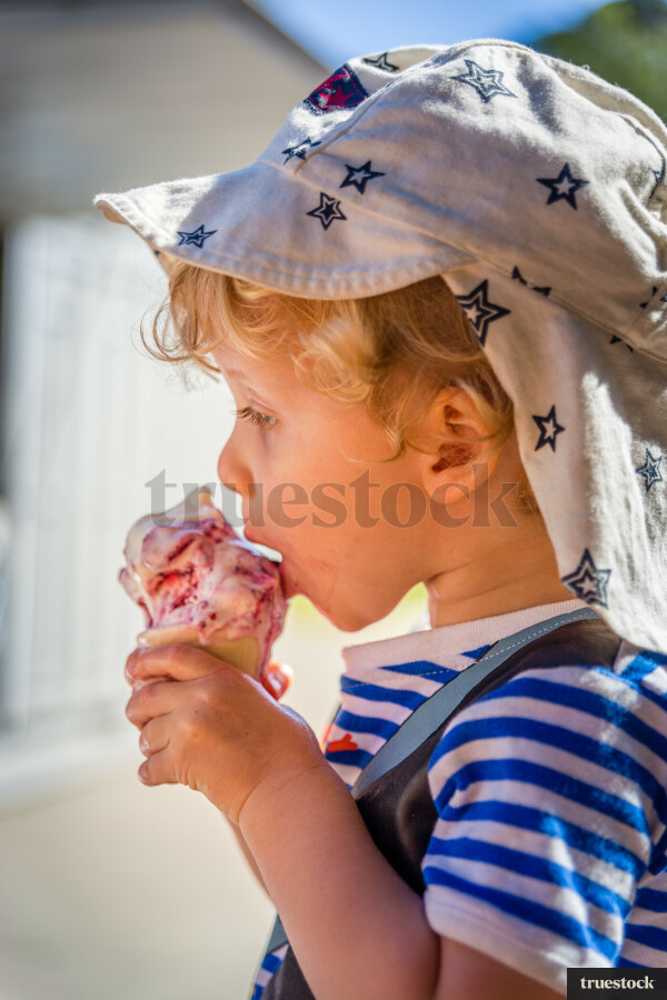 Toddler eating an ice cream
