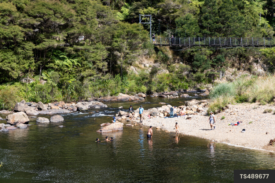 Family on riverbank