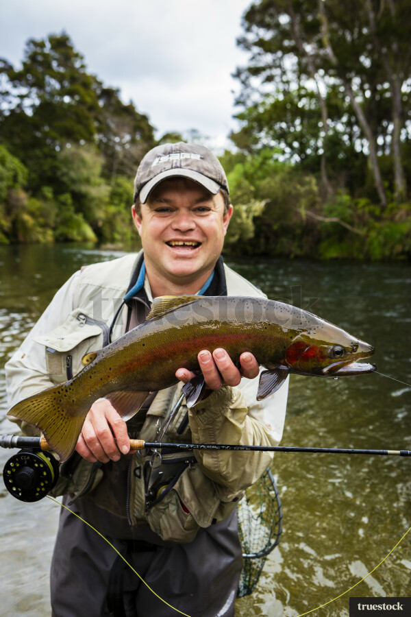 Fisherman Holding Fish