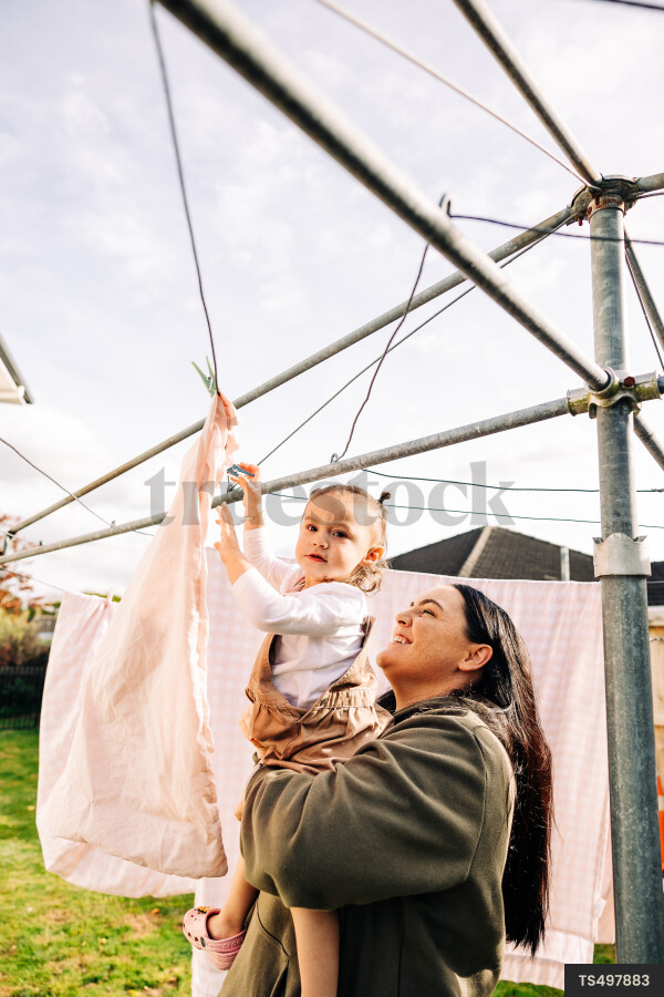 Young Girl Helping with Laundry