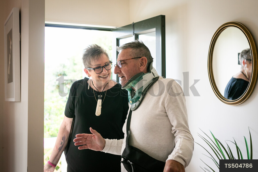 Health carer and patient at front door
