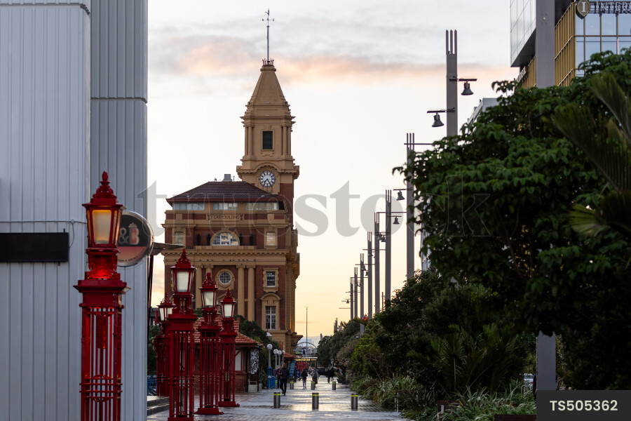 Commuters walking on footpath in city