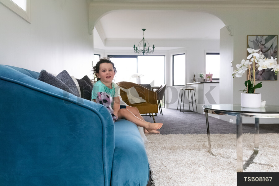Girl sitting on sofa