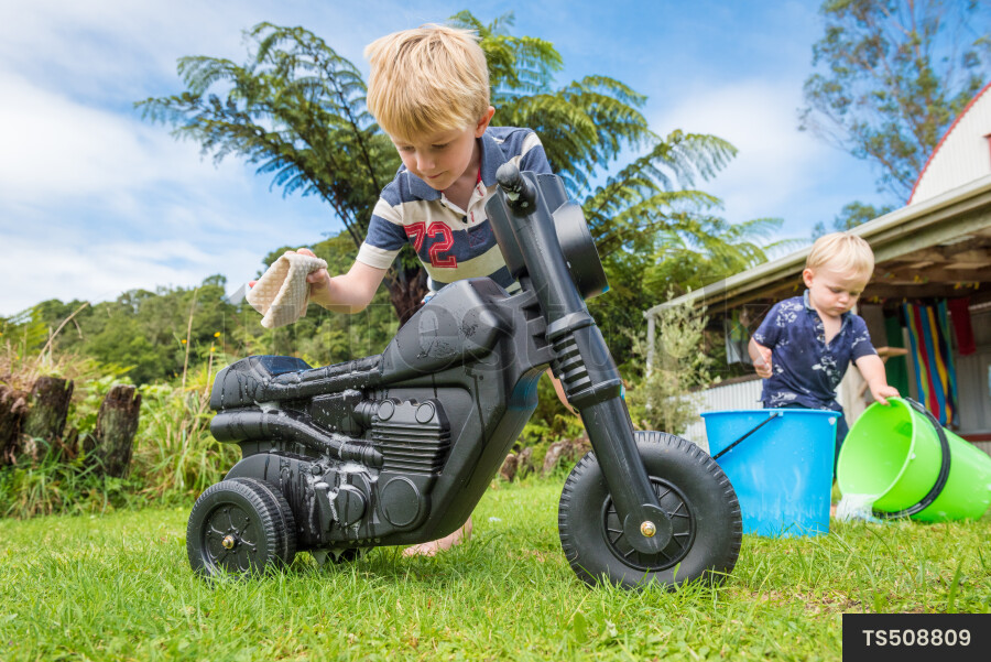 Young Boy with Toy Bike