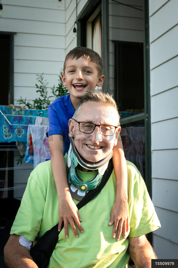 Smiling man with his grandson