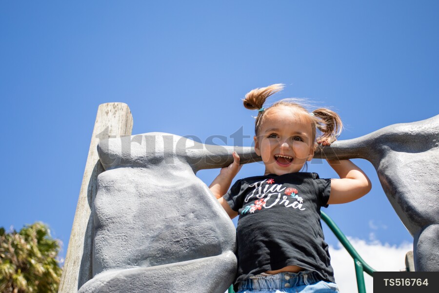 Young Girl by Rock Wall