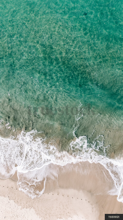 Aerial view of waves on beach